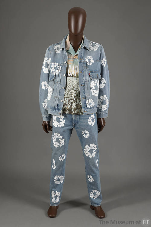 Denim button front jacket with all over white printed wreath design, matching jeans and graphic…