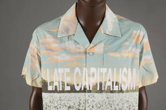 Short sleeve button up shirt with graphic landscape print and text Late Capitalism