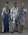 Three denim and indigo ensembles: Dress with bustier and ankle length skirt, man’s denim jacket…