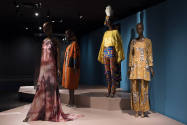 Africa’s Fashion Diaspora exhibition installation view of four dressed mannequins in the “Reach…