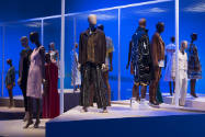 Africa’s Fashion Diaspora exhibition installation view of dressed mannequins on multiple platfo…
