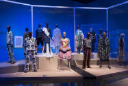 Africa’s Fashion Diaspora exhibition view of dressed mannequins in the “History Is Political” a…