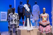 Africa’s Fashion Diaspora exhibition installation view of sixed dressed mannequins in the “Hist…