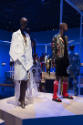 Africa’s Fashion Diaspora exhibition installation view of two mannequins in white and black ens…
