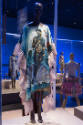 Africa’s Fashion Diaspora exhibition installation view of a mannequin in a blue and pink printe…
