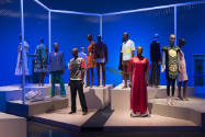 Africa’s Fashion Diaspora exhibition installation view of dressed mannequins on multiple platfo…
