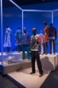 Africa’s Fashion Diaspora exhibition installation view of seven dressed mannequins and a case i…