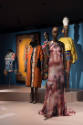 Africa’s Fashion Diaspora exhibition installation view of five dressed mannequins and a textile…