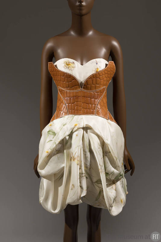 Ivory floral printed strapless mini dress with draped and pleated pouf skirt and brown leather …