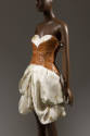 ¾ view of dress showing anatomical white topstitching on corset and plunging bustline to reveal…