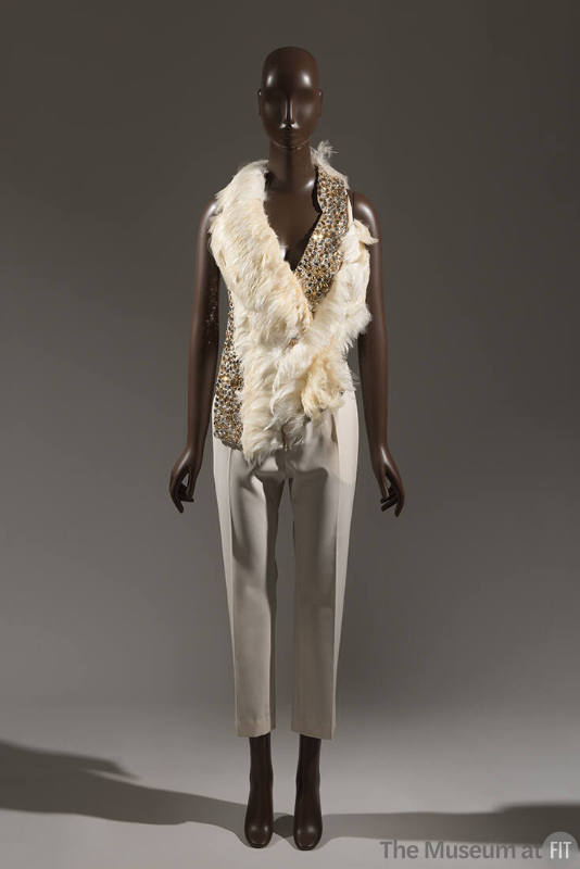 Off-white halter-style top trimmed with feathers and crystals and ivory slim tapered cropped pa…