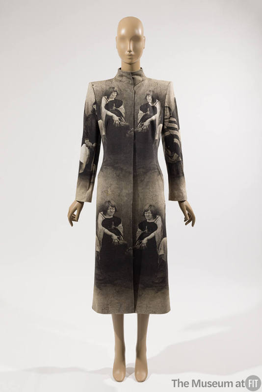 Calf length coat with blind colony photo print throughout and short stand collar