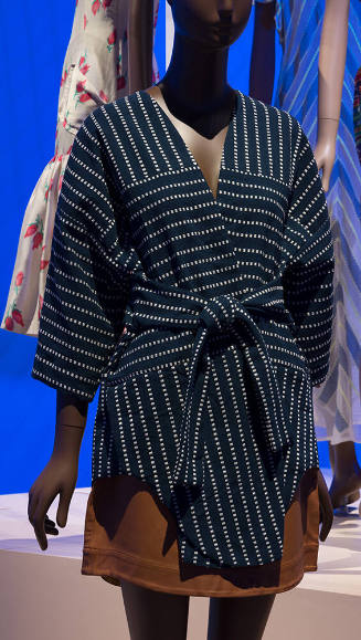 Navy blue short kimono with beige dot stripe pattern and tie belt and tan leather mini skirt