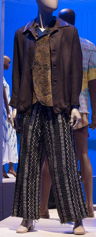 Man’s ensemble of brown button front jacket, top with brown abstract print and brown and white …