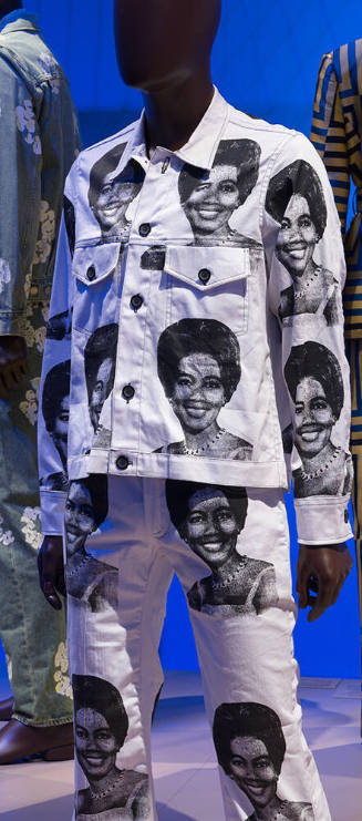 Man’s set of matching white button front jacket and pants with repeated photo print of the Ivor…