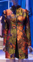 Orange, green, purple and metallic floral zip front coat with stand collar and ruffled sleeve s…
