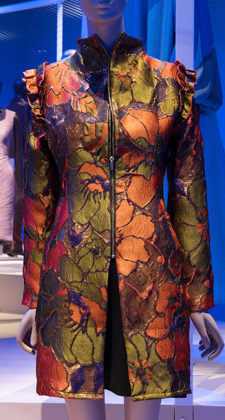 Orange, green, purple and metallic floral zip front coat with stand collar and ruffled sleeve s…