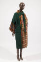 Green coat with vertical orange, white, black and blue geometric designs and oversize collar