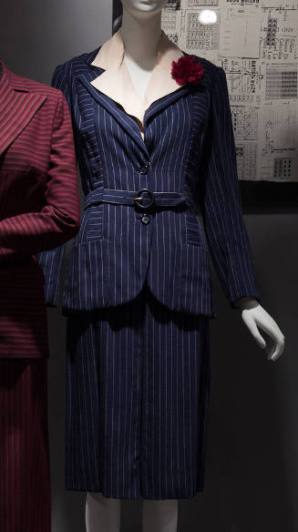Navy blue and white pinstriped suit with matching belt, knee length straight skirt, white colla…