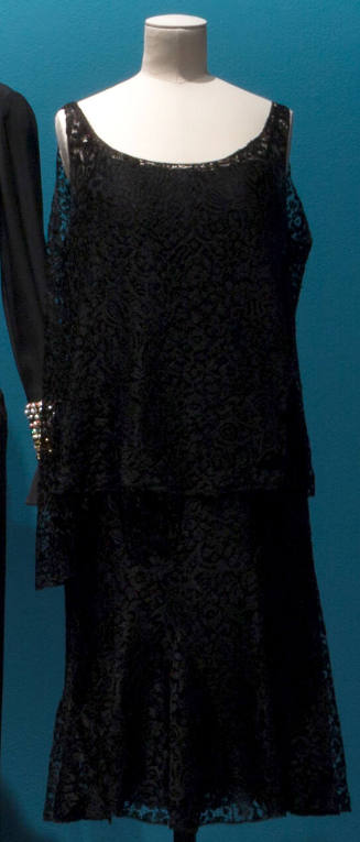 Black lace two-piece evening dress with round neck and slightly flared tunic top and matching s…