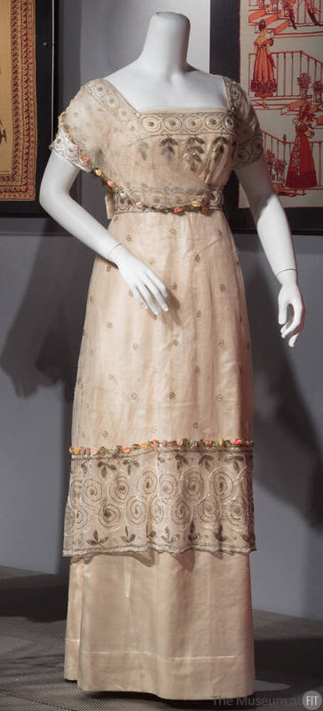 Off white and net floor length evening dress beaded with silver and white beads, short sleeves …