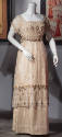 Off white and net floor length evening dress beaded with silver and white beads, short sleeves …