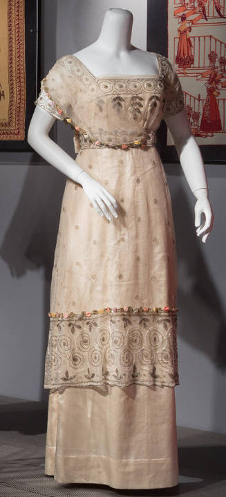Off white and net floor length evening dress beaded with silver and white beads, short sleeves …