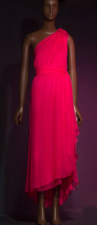Hot pink one shoulder evening dress with tie sash at waist and asymmetrical ankle length skirt …