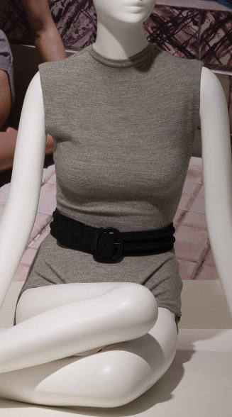 Grey bathing suit with high neck, long torso and high cut leg with black belt 