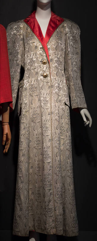 Grey, black and gold brocade floor length evening coat with woven winged Pegasus motif, red lap…