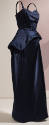 Navy blue floor length evening dress with thin straps, fitted bodice and asymmetrical fold at h…