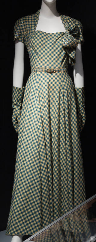 Teal and yellow gingham floor length dinner dress with bolero-effect sleeves, large bow on left…