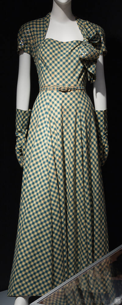 Teal and yellow gingham floor length dinner dress with bolero-effect sleeves, large bow on left…