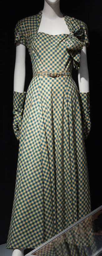 Teal and yellow gingham floor length dinner dress with bolero-effect sleeves, large bow on left…