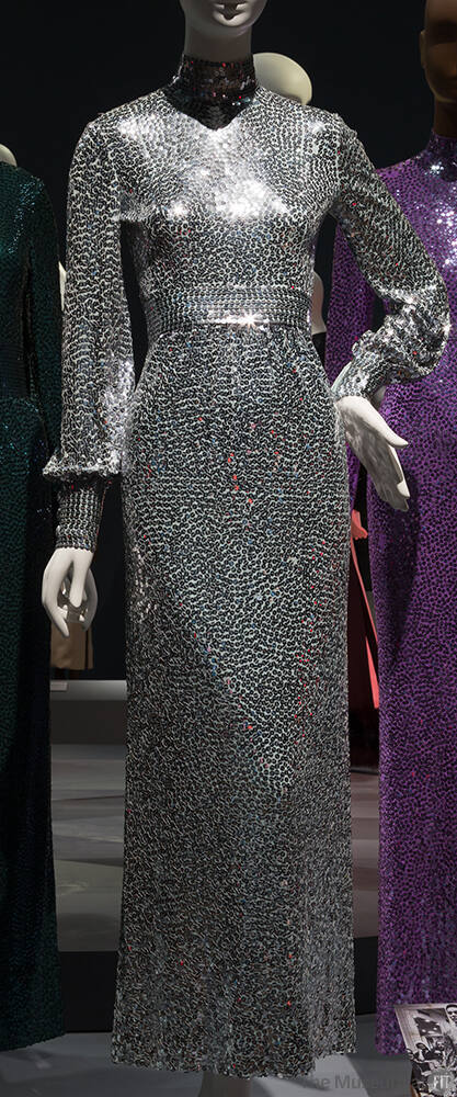 Silver / blue sequined floor length evening dress with band collar, long cuffed sleeves and ins…
