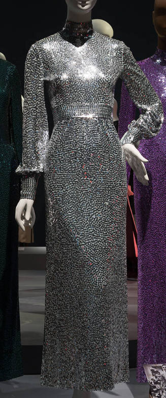 Silver / blue sequined floor length evening dress with band collar, long cuffed sleeves and ins…