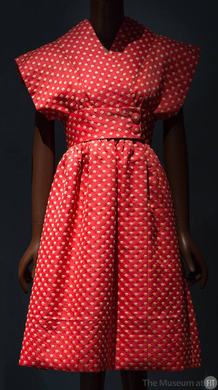 Bright pink and yellow polka dot knee length dress with cross over front, kimono cap sleeves an…