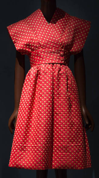 Bright pink and yellow polka dot knee length dress with cross over front, kimono cap sleeves an…