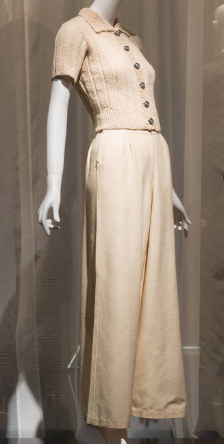 Off-white short sleeve ribknit sweater with silver buttons and matching wide leg pants