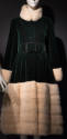 Dark green velvet calf length evening coat with white fur stand collar, cuffs and skirt band fr…