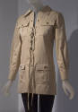Beige safari jacket with lace up front and button front flap pockets on both sides of chest and…