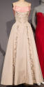 Grey strapless floor length ball gown with pink band at bodice and floral / foliage beading dow…