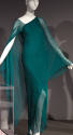 Teal green one shoulder evening dress in layers of silk chiffon, wrap style over arms creates a…