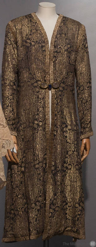 Gold and black brocade evening coat with allover Oriental style patterns, gold braid trim and c…