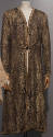 Gold and black brocade evening coat with allover Oriental style patterns, gold braid trim and c…