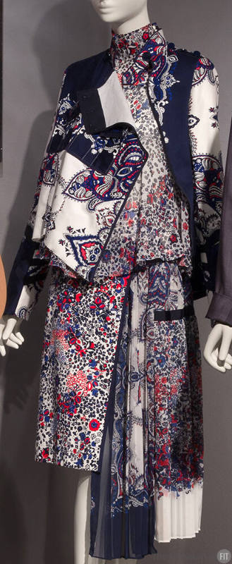 Red, white, blue and navy blue floral print ensemble of band collar jacket, high band collar bl…