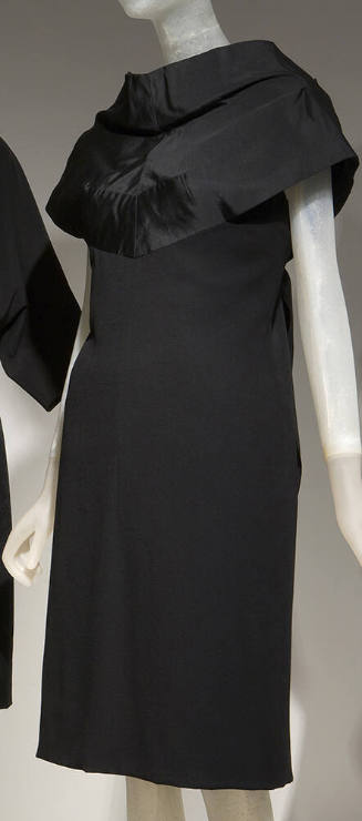 Black above the knee dress with black silk standaway over-bodice extending over shoulders 