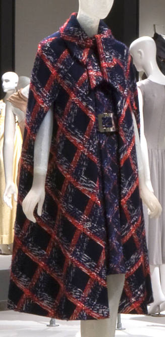 Navy blue, red and white plaid cape with roll collar tied at neck and matching knee length dres…