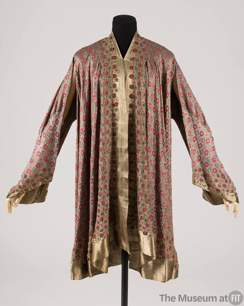 Gold lame evening coat with red and green rondel motif, gold lame trim, open front and open, dr…