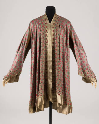 Gold lame evening coat with red and green rondel motif, gold lame trim, open front and open, dr…